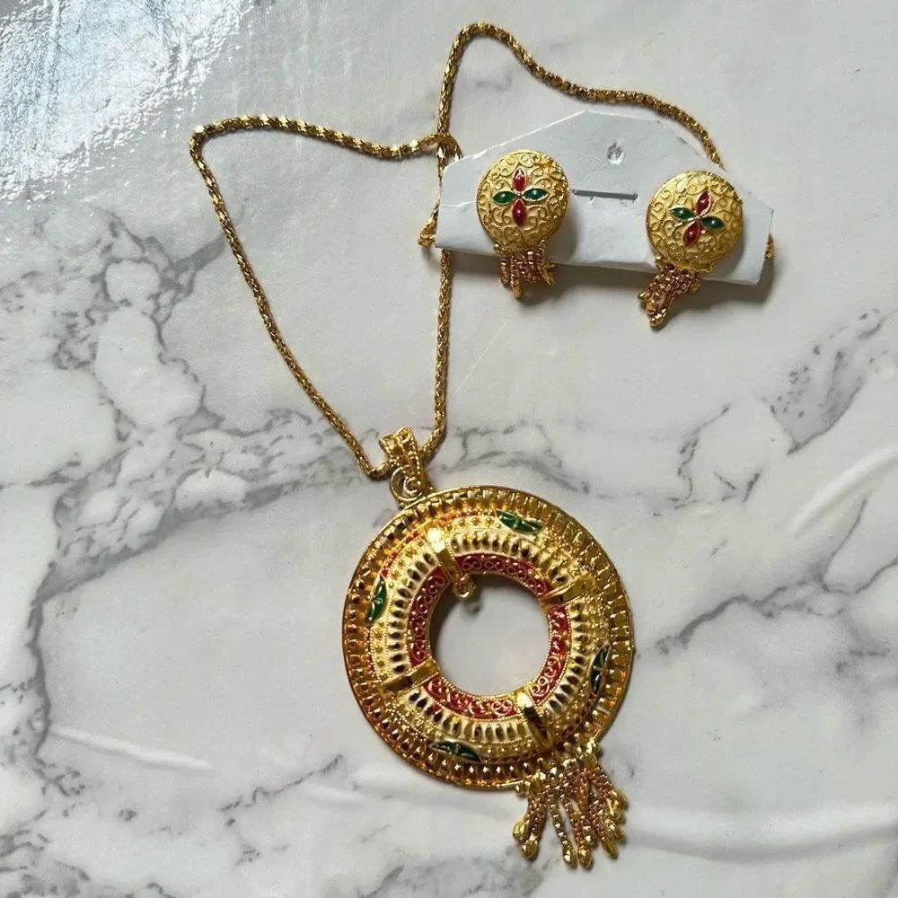 Gold tone red and green necklace and earrings set